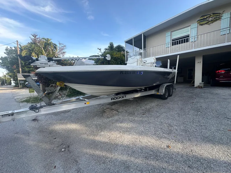 Slide: The Image of 2021 Skeeter SX 2250 boat on a trailer in a driveway. - 27