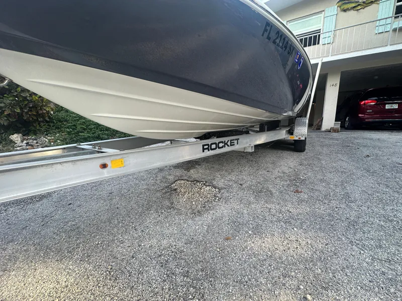 Slide: The Image of 2021 Skeeter SX 2250 boat on a Rocket trailer in a driveway. - 28