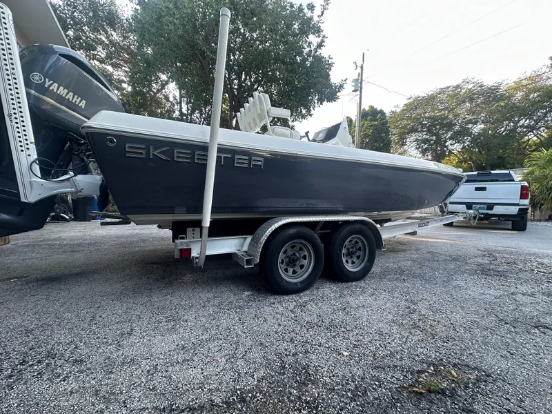 Slide: The Image of 2021 Skeeter SX 2250 boat on a trailer with Yamaha outboard motor. - 29