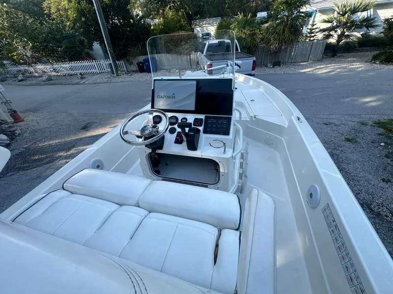 Slide: The Image of 2021 Skeeter SX 2250 boat interior with steering console and Garmin navigation system. - 5