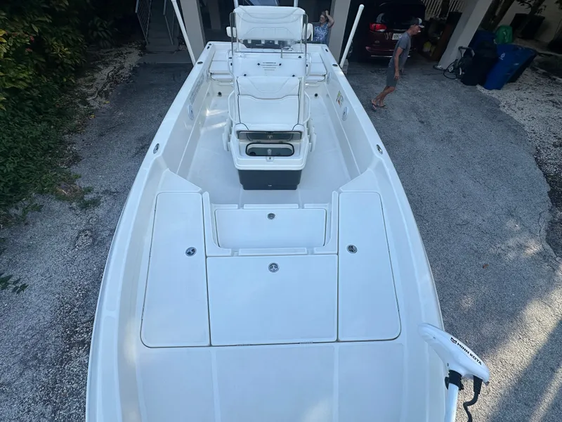 Slide: The Image of 2021 Skeeter SX 2250 boat, top view, parked on gravel driveway. - 6