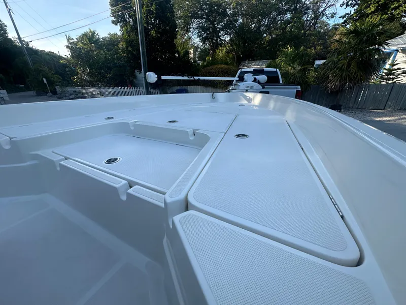 Slide: The Image of 2021 Skeeter SX 2250 boat deck with storage compartments. - 8