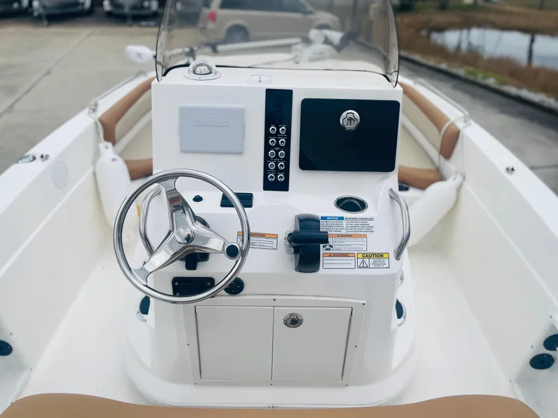 Slide: The Image of 2023 NauticStar 2110 Nautic Bay boat console with steering wheel and controls. - 4