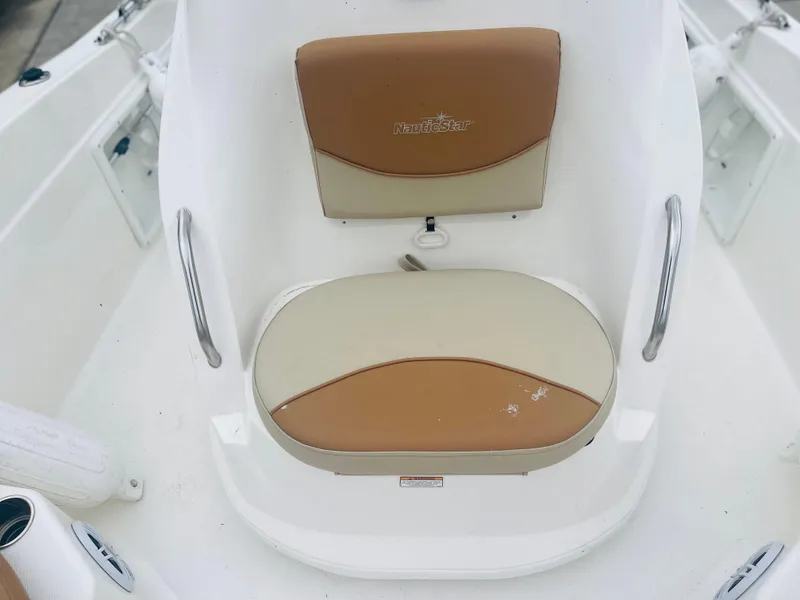 Slide: The Image of 2023 NauticStar 2110 Nautic Bay boat seat with tan and beige cushions. - 7