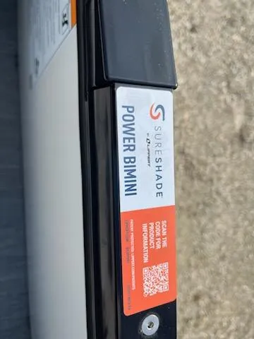 Slide: The Image of SureShade Power Bimini on a 2024 Godfrey 2286SFL boat. - 15