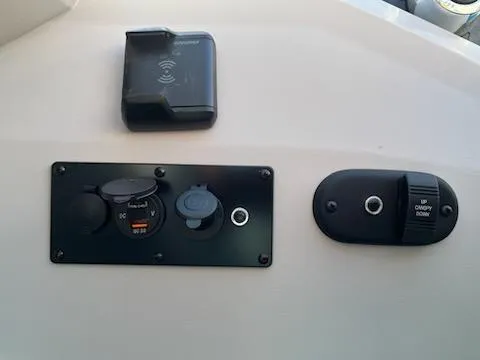 Slide: The Image of Control panel of 2024 Godfrey 2286sfl boat with switches and charging port. - 5