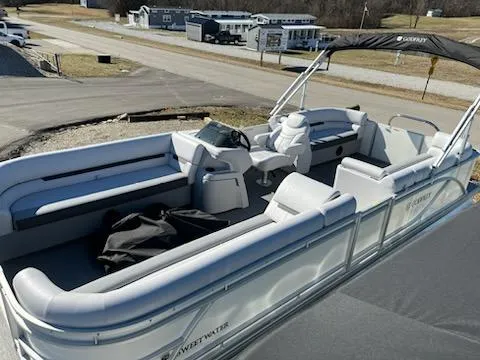 Slide: The Image of 2024 Sweetwater 2286SB pontoon boat with spacious seating and modern design. - 1