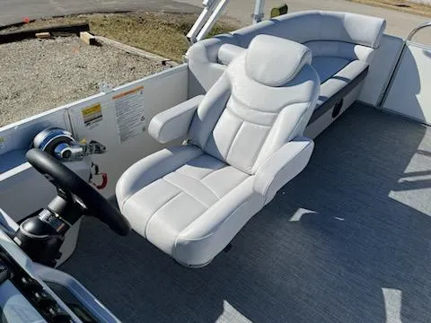 Slide: The Image of 2024 Sweetwater 2286SB boat interior with plush captain's chair and spacious seating. - 10