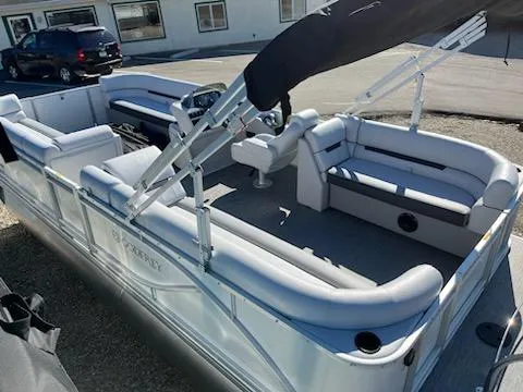 Slide: The Image of 2024 Godfrey 2286SB pontoon boat with spacious seating and modern design. - 3