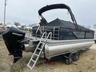 Slide: The Image of 2024 Godfrey 2286sfl pontoon boat with Mercury outboard engine on trailer. - 12