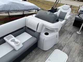 Slide: The Image of 2024 Godfrey 2286sfl boat interior with seating and console. - 15