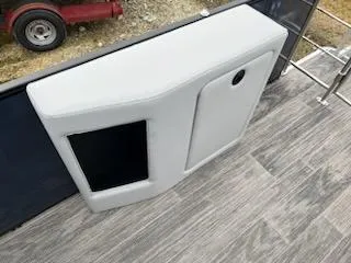 Slide: The Image of 2024 Godfrey 2286sfl boat interior with storage compartment and modern flooring. - 16