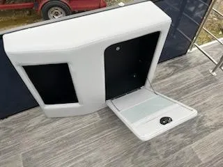 Slide: The Image of 2024 Godfrey 2286sfl boat storage compartment with open hatch on deck. - 19