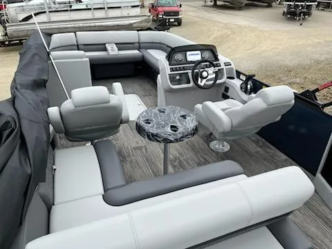 Slide: The Image of 2024 Godfrey 2286sfl pontoon boat interior with seating and helm station. - 5