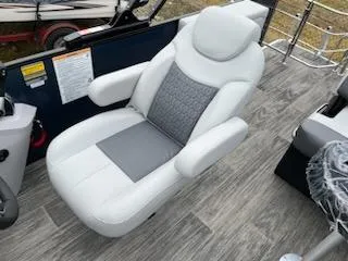 Slide: The Image of Luxurious captain's chair on 2024 Godfrey 2286sfl pontoon boat with gray and white upholstery. - 8