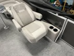 Slide: The Image of 2023 Godfrey 2286SBX boat interior with reclining seat and cup holders. - 4