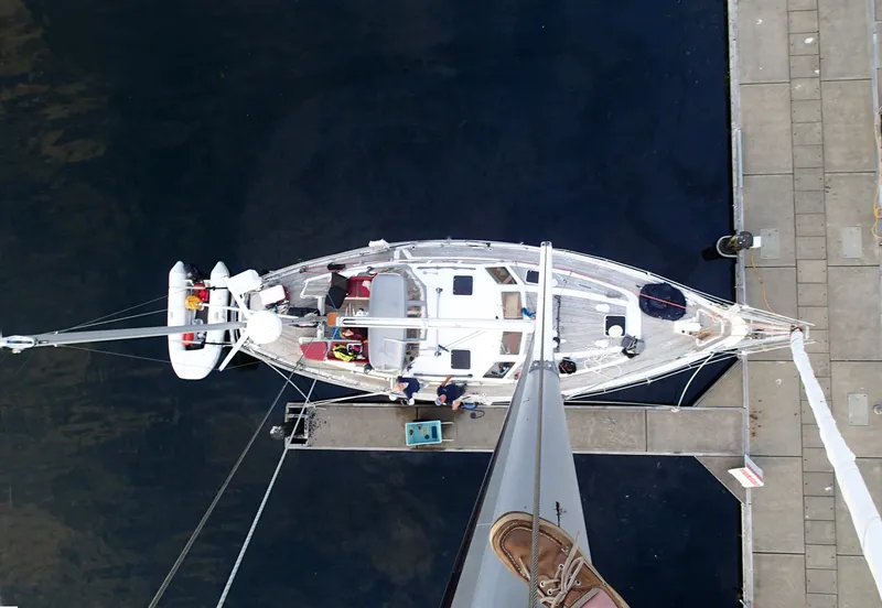 Slide: The Image of Overhead view of a 1985 Nauticat 43 sailboat docked at a marina. - 2