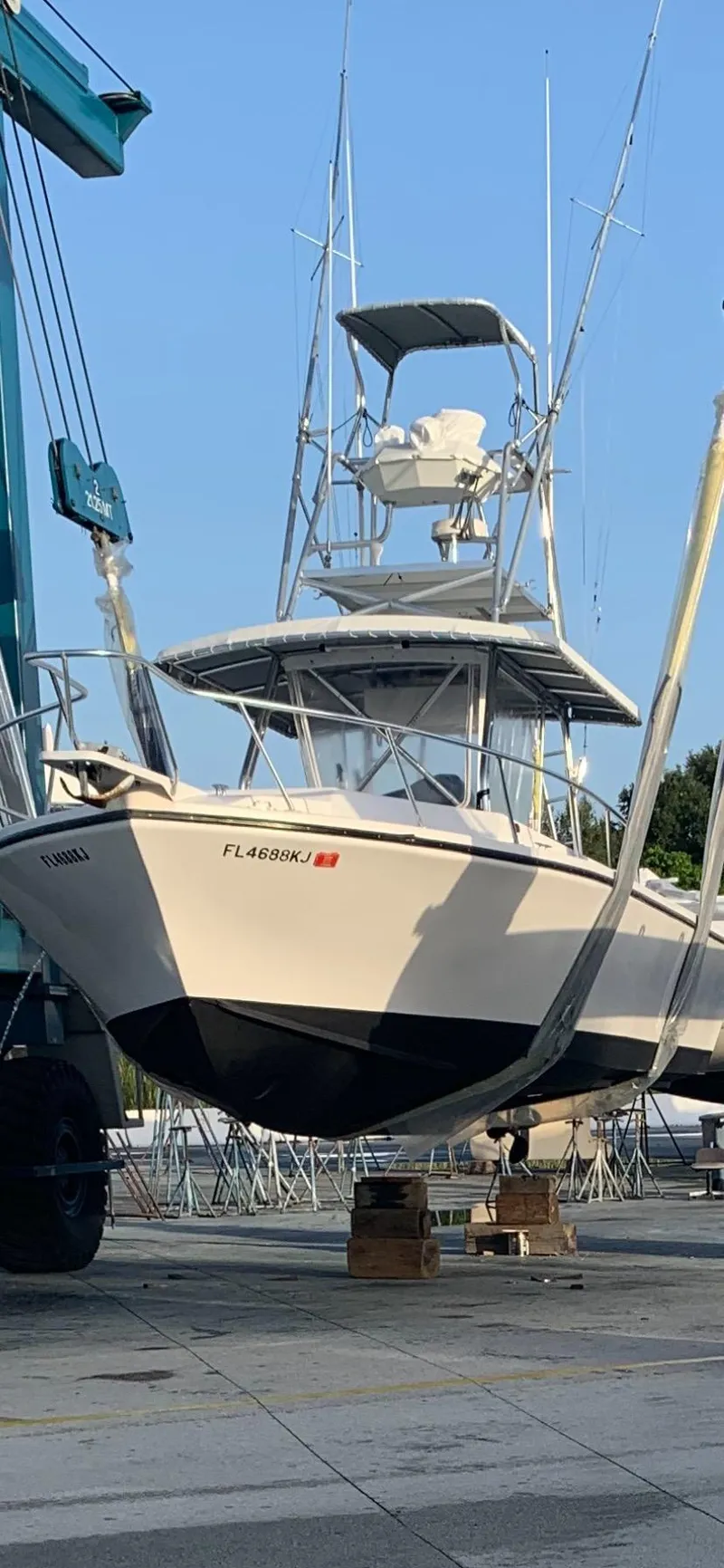 Slide: The Image of 1997 Island Hopper 30 Open boat in dry dock, ready for maintenance. - 19