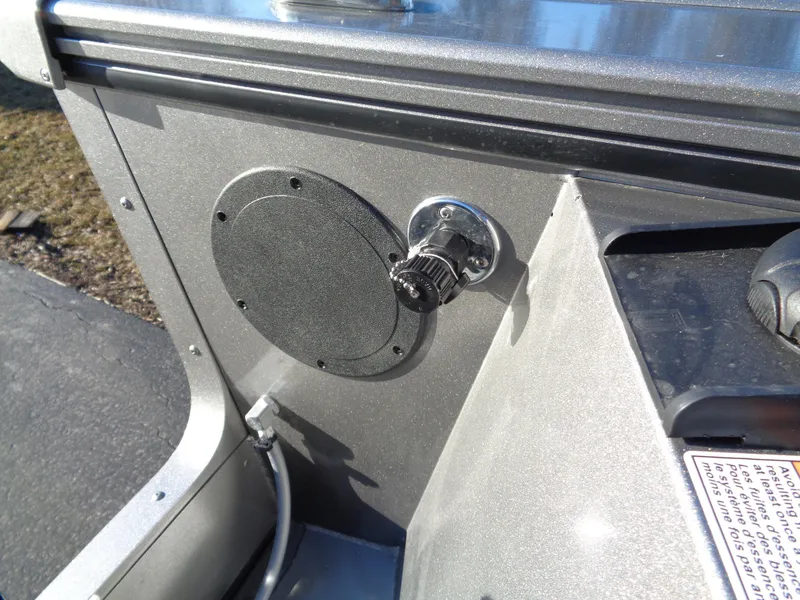 Slide: The Image of 2024 Lund 1875 Fisherman boat detail showing a mounted speaker and control knob. - 11