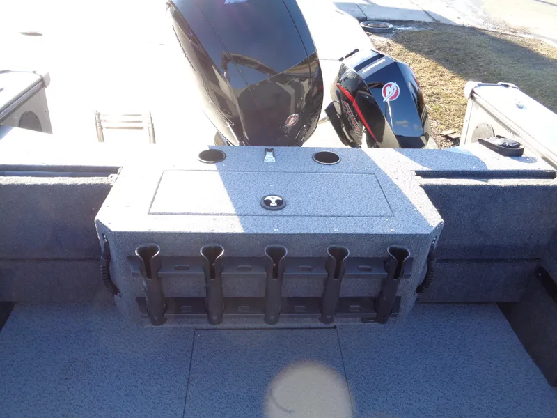 Slide: The Image of 2024 Lund 1875 Fisherman boat interior with rod holders and motor. - 12