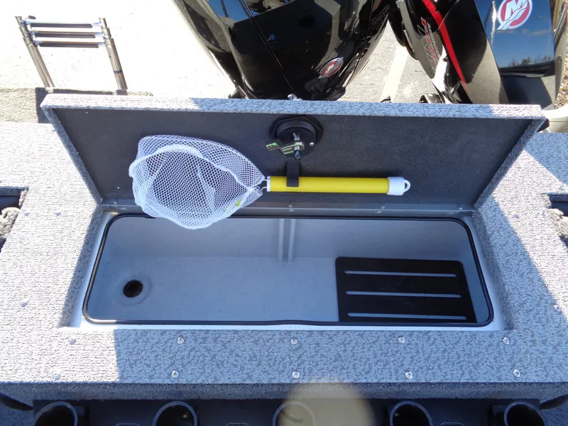 Slide: The Image of 2024 Lund 1875 Fisherman boat storage compartment with fishing net. - 13