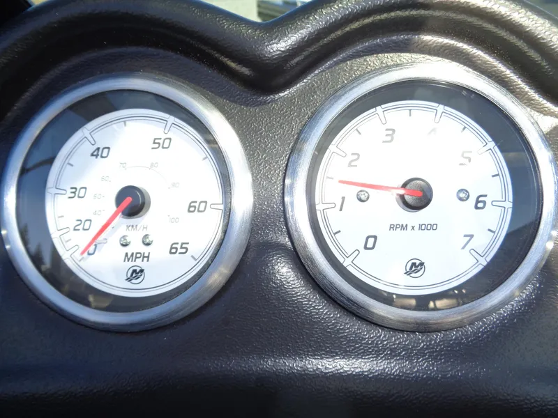 Slide: The Image of 2024 Lund 1875 Fisherman dashboard with speedometer and tachometer gauges. - 23