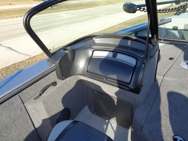 Slide: The Image of 2024 Lund 1875 Fisherman boat interior with open windshield and seating. - 26