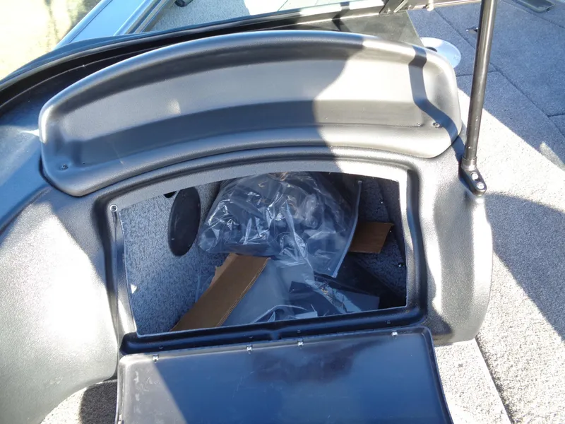 Slide: The Image of 2024 Lund 1875 Fisherman boat storage compartment with open lid. - 27