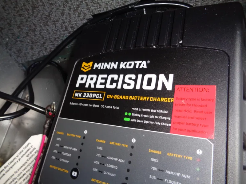 Slide: The Image of Minn Kota Precision MK 330PCL on-board battery charger in 2024 Lund 1875 Fisherman boat. - 30