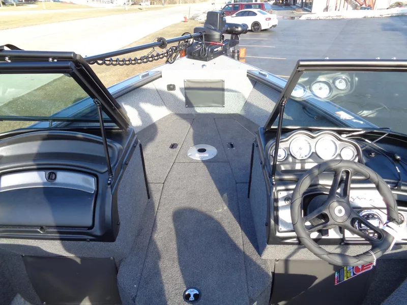 Slide: The Image of 2024 Lund 1875 Fisherman boat interior with steering wheel and dashboard. - 35