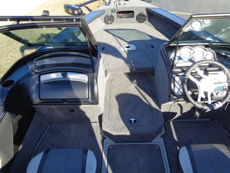 Slide: The Image of 2024 Lund 1875 Fisherman boat interior with steering wheel and seating. - 43