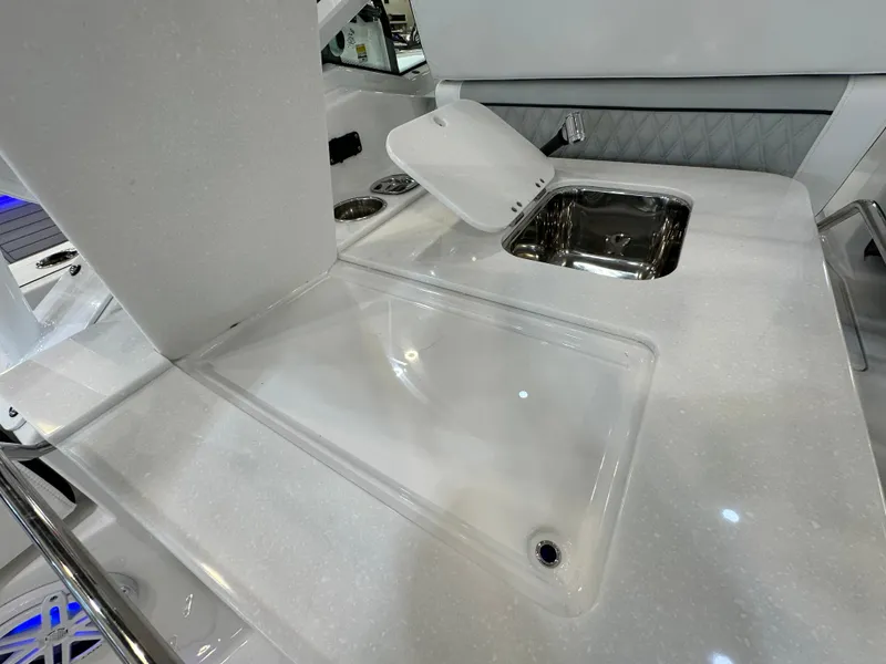Slide: The Image of 2024 Blackfin 302 DC boat interior with sleek countertop and sink. - 13