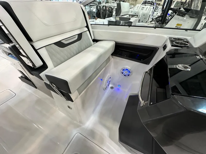 Slide: The Image of 2024 Blackfin 302 DC boat interior with modern seating and LED lighting. - 19