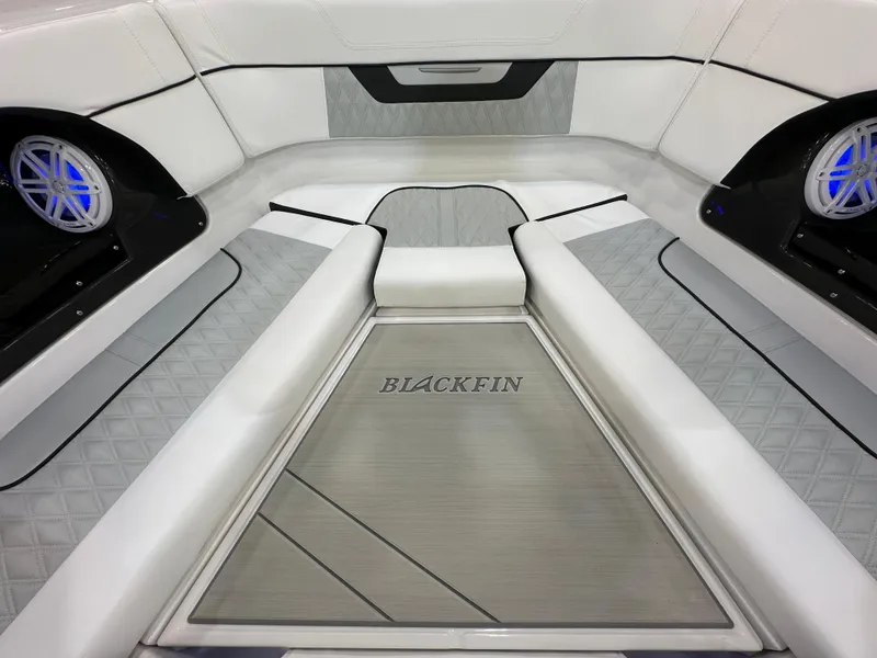 Slide: The Image of 2024 Blackfin 302 DC boat interior with sleek seating and modern design. - 23