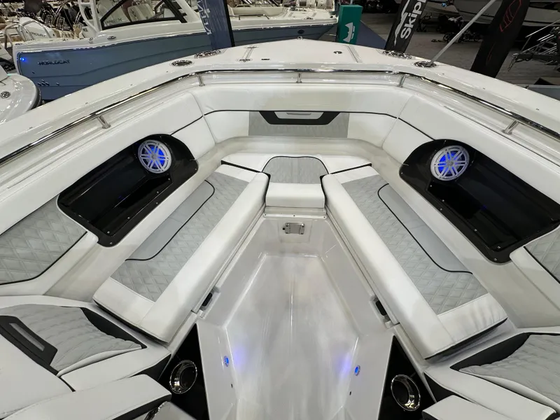 Slide: The Image of 2024 Blackfin 302 DC boat interior with luxurious seating and modern speakers. - 25