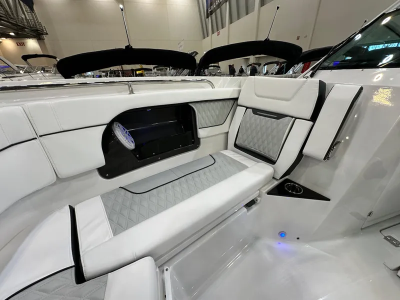 Slide: The Image of 2024 Blackfin 302 DC boat interior with luxurious white seating and modern design. - 26