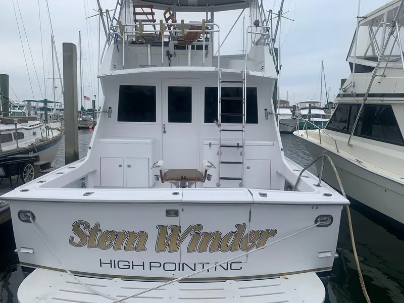 Slide: The Image of 1974 Hatteras 46 Convertible boat docked, named "Stem Winder," High Point, NC. - 1