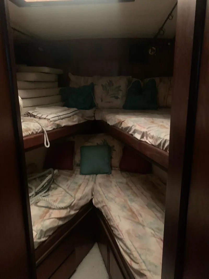 Slide: The Image of Cozy cabin interior of 1974 Hatteras 46 Convertible with bunk beds and cushions. - 18