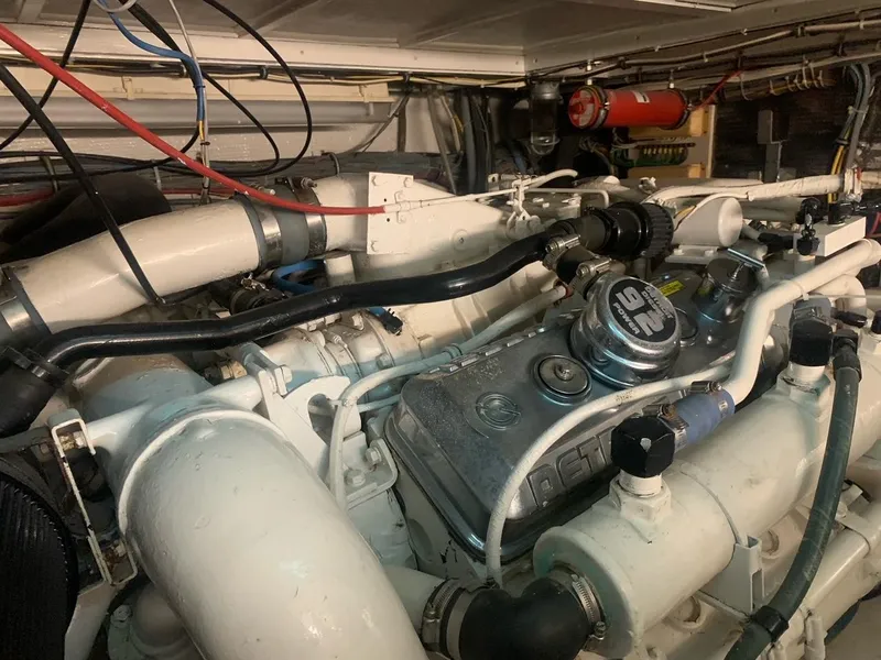 Slide: The Image of Engine room of 1974 Hatteras 46 Convertible boat, showcasing detailed mechanical components. - 20