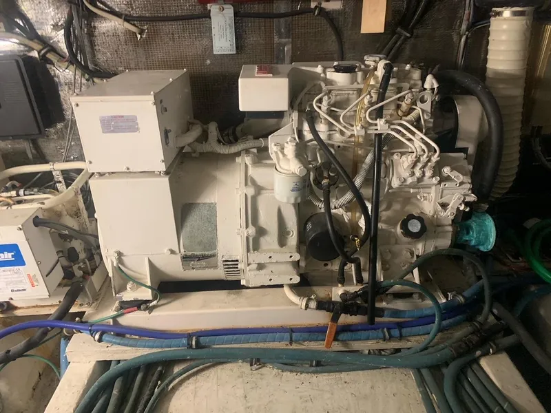 Slide: The Image of Engine room of 1974 Hatteras 46 Convertible with visible machinery and wiring. - 23