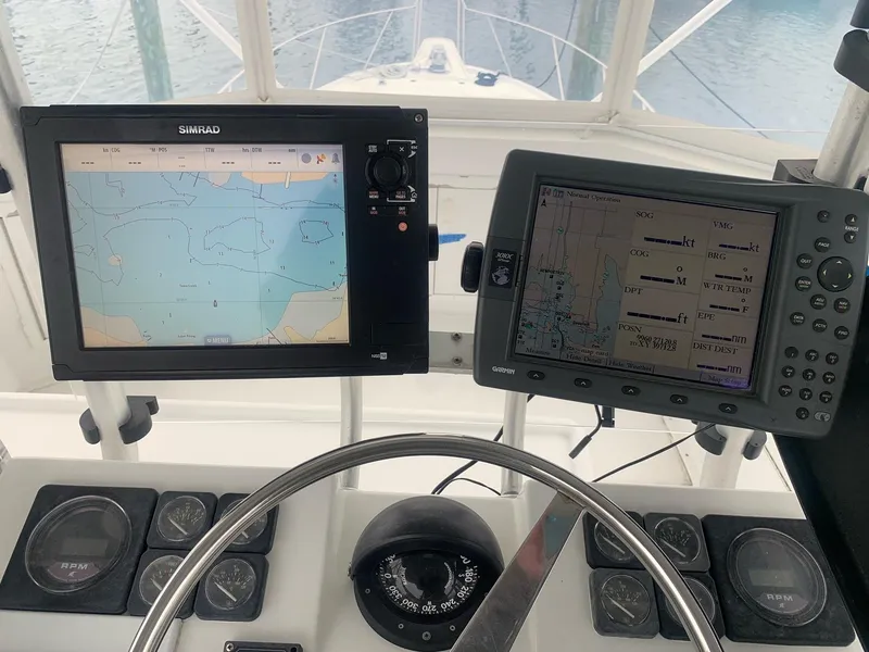 Slide: The Image of Helm of 1974 Hatteras 46 Convertible with navigation screens and compass. - 4