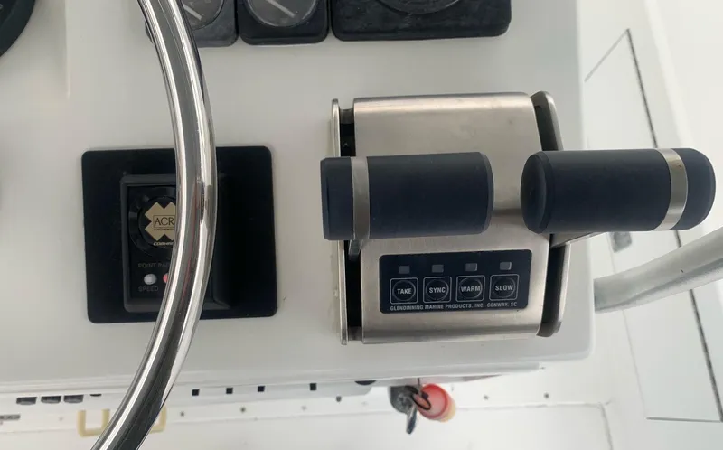 Slide: The Image of Close-up of 1974 Hatteras 46 Convertible boat controls and steering wheel. - 8