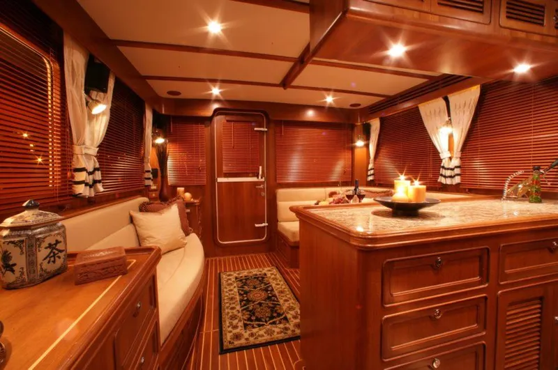 Slide: The Image of Luxurious interior of 2026 Selene 45 Classic Explorer yacht with warm wood finishes. - 14