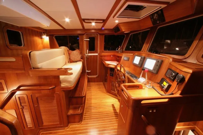 Slide: The Image of Luxurious interior of 2026 Selene 45 Classic Explorer yacht with wooden finishes and modern navigation equipment. - 15