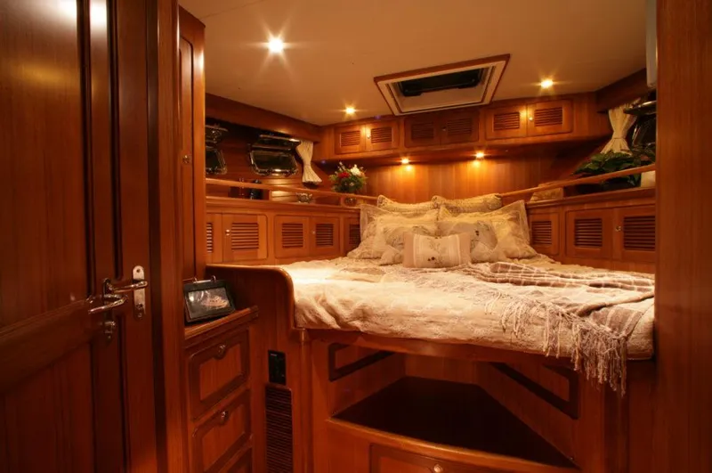 Slide: The Image of Luxurious cabin interior of 2026 Selene 45 Classic Explorer yacht, featuring elegant wood finishes. - 17