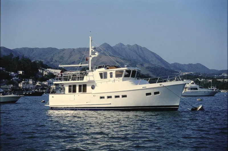 Slide: The Image of Selene 45 Classic Explorer yacht, 2026 model, anchored in scenic coastal waters. - 5