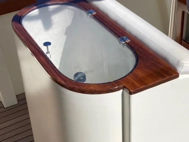Slide: The Image of Custom 24' Center Console boat livewell with wooden trim, 2014 model. - 10