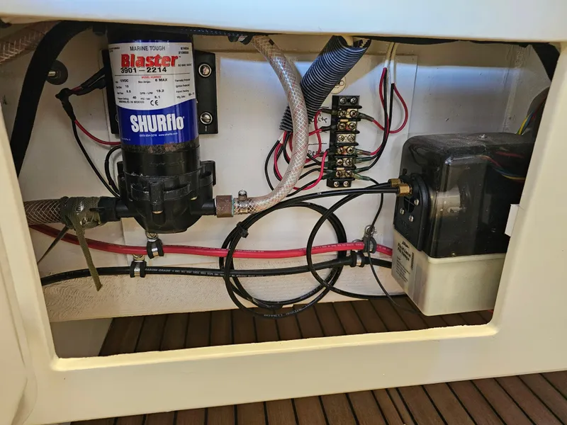 Slide: The Image of 2014 Custom 24' Center Console boat wiring and pump system. - 18