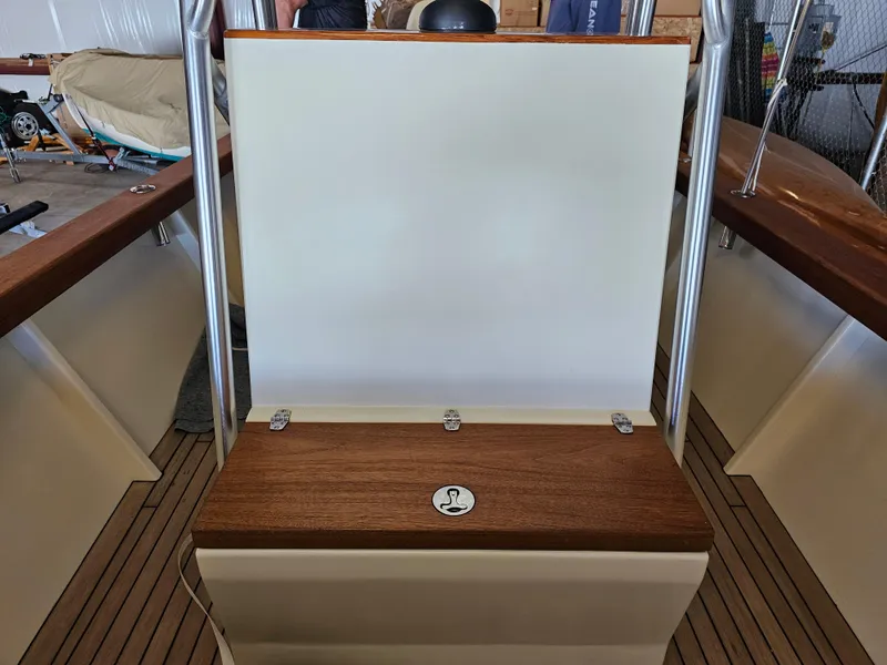 Slide: The Image of 2014 Custom 24' Center Console boat interior with wood accents and stainless steel fittings. - 21