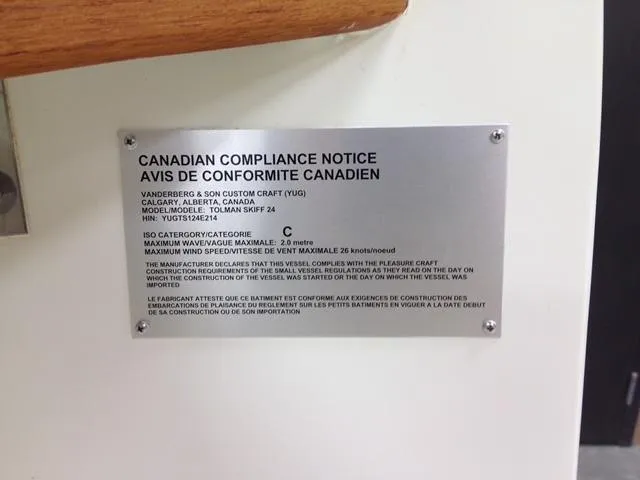 Slide: The Image of Canadian compliance notice plaque on 2014 Custom 24' Center Console boat. - 23